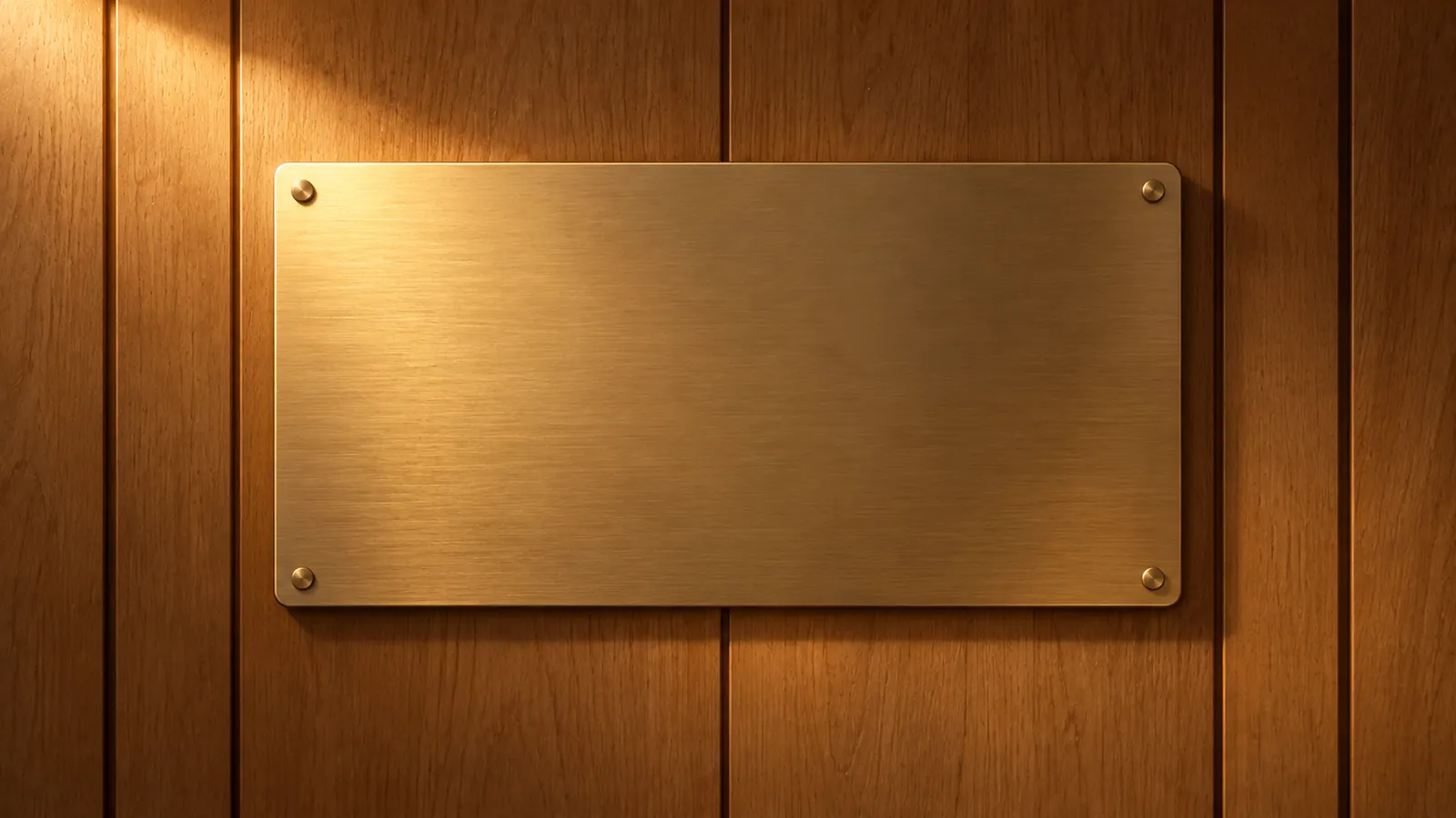 A brass plaque on an oak wall